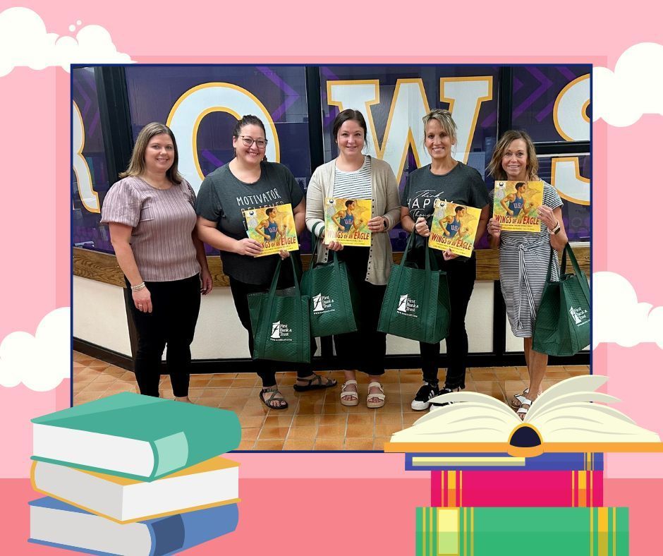 Lincoln’s 3rd grade teachers smiling as they hold up the donated books from First Bank & Trust.
