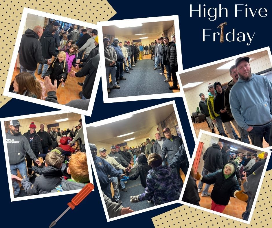 Dads greeting students with high fives as they enter the building.