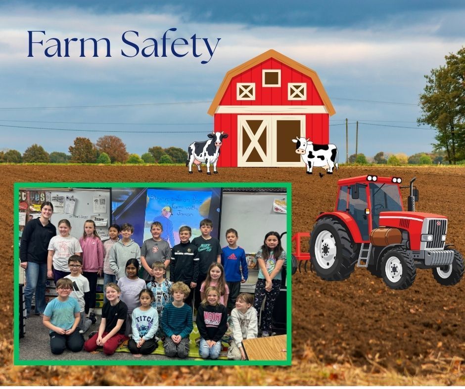 Lake Area Technical College students standing with Lincoln Elementary students while presenting a farm safety lesson in a classroom.