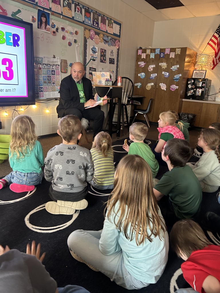 Dr. Danielson  reading to first graders