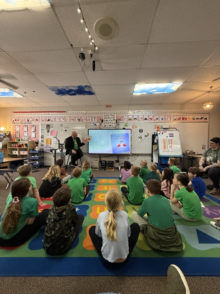 Dr. Danielson  reading to first graders