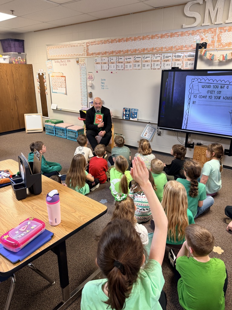 Dr. Danielson  reading to first graders