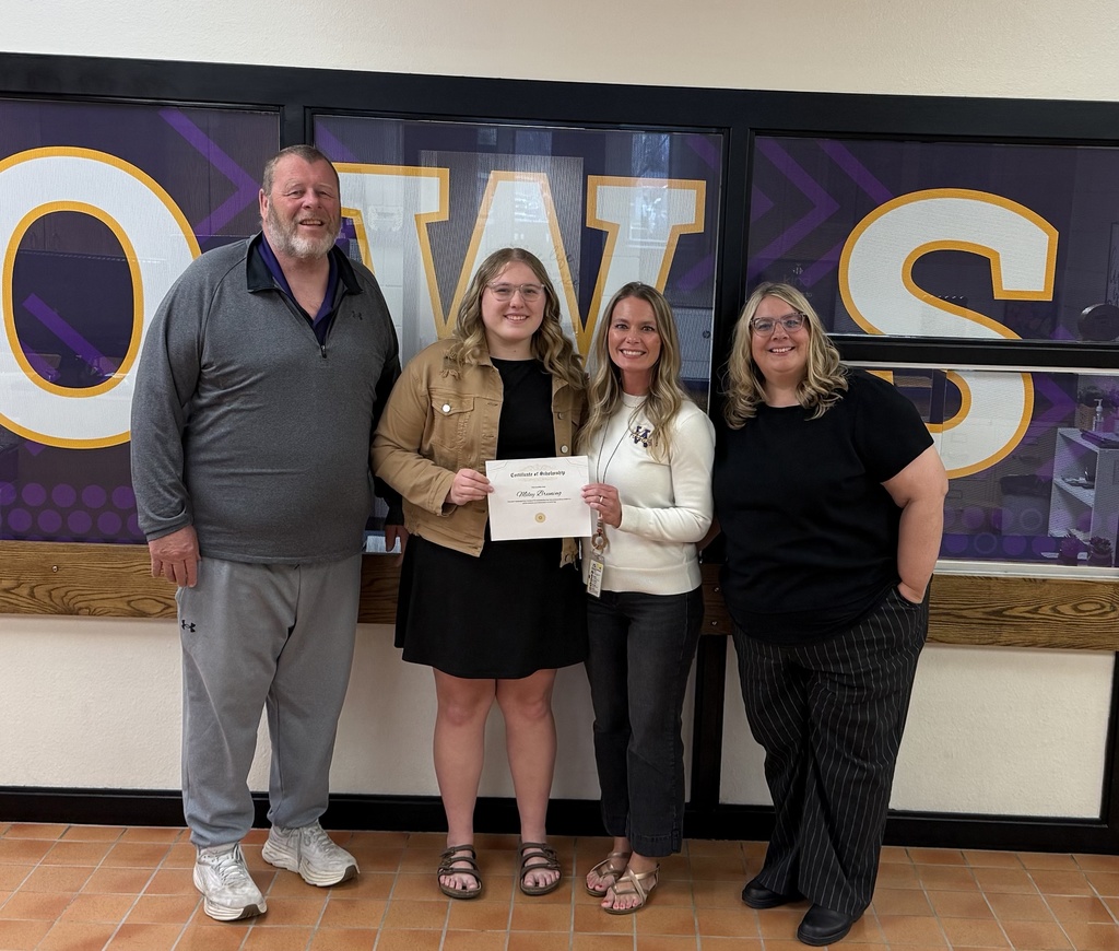 Miley Bruning with her scholarship certificate.