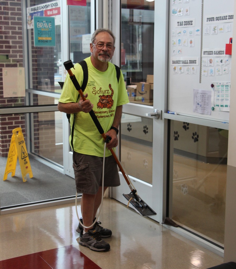 Staff deep cleaning classroom