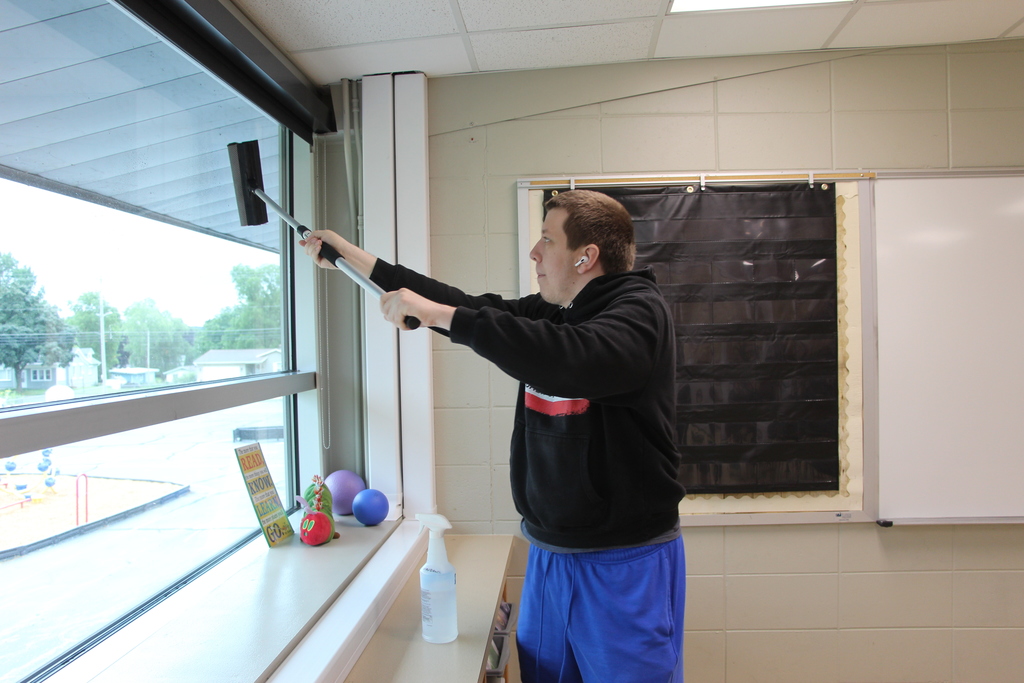 Staff deep cleaning classroom