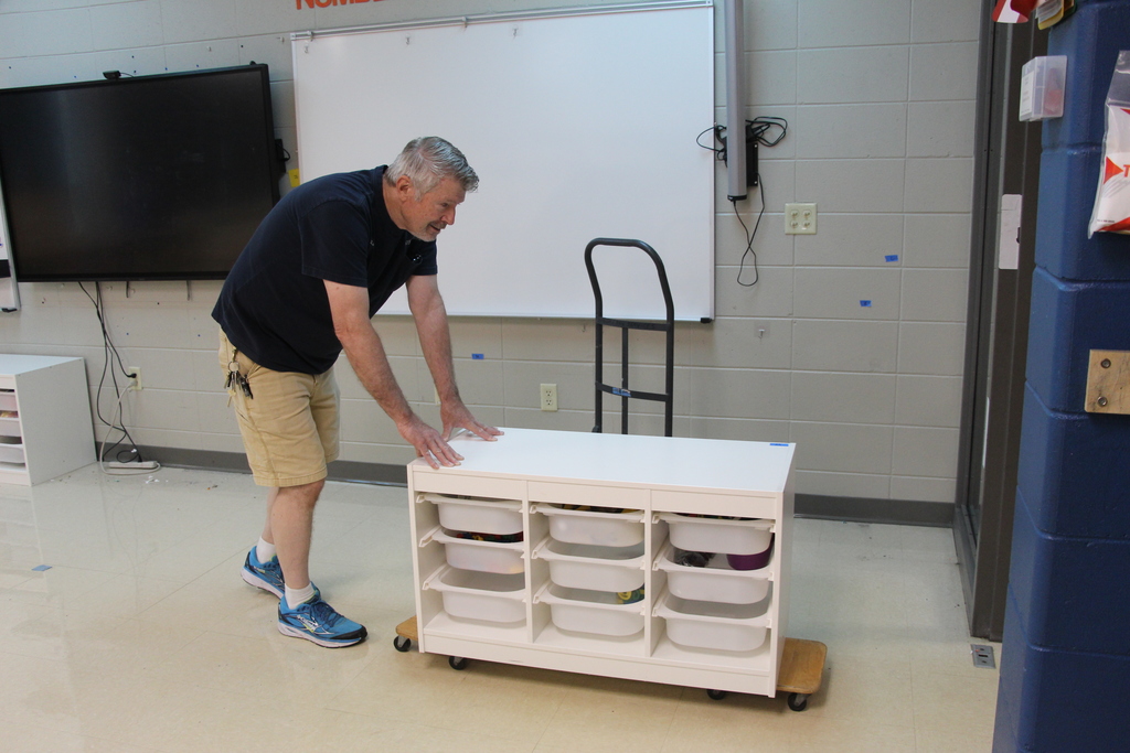 Staff deep cleaning classroom