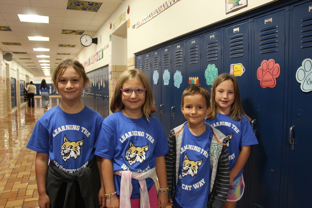 Webster Students and Staff wearing 100% every day shirts