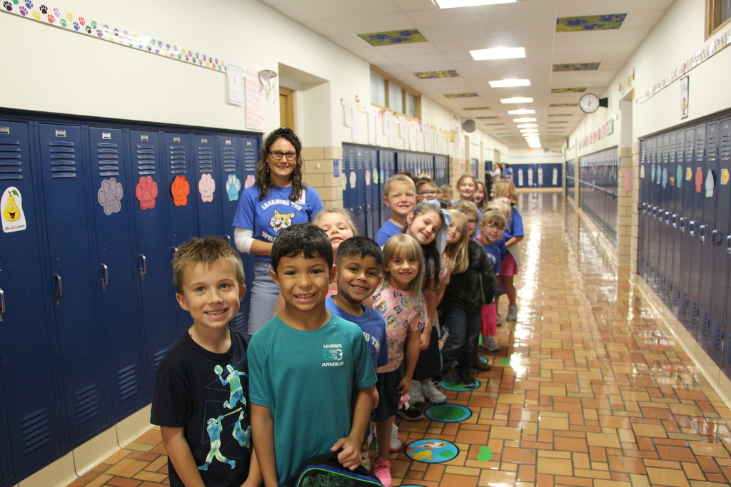 Webster Students and Staff wearing 100% every day shirts