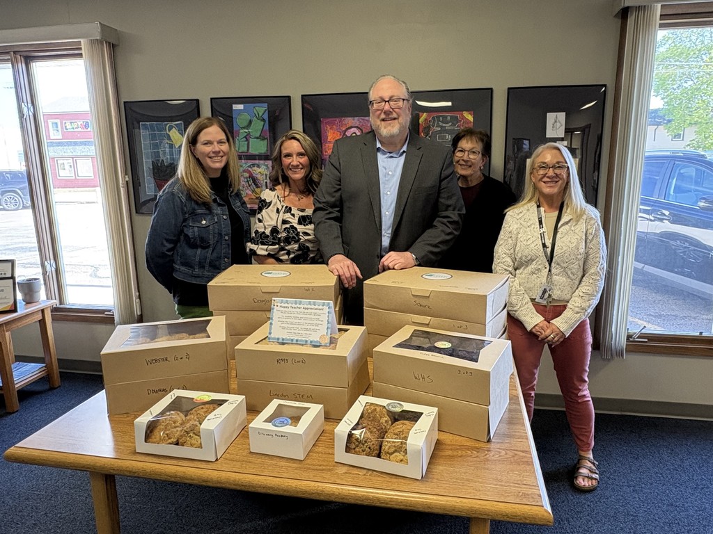District Leadership Team is pictured with Teacher Appreciation Week cookies prior to delivery to school buildings.