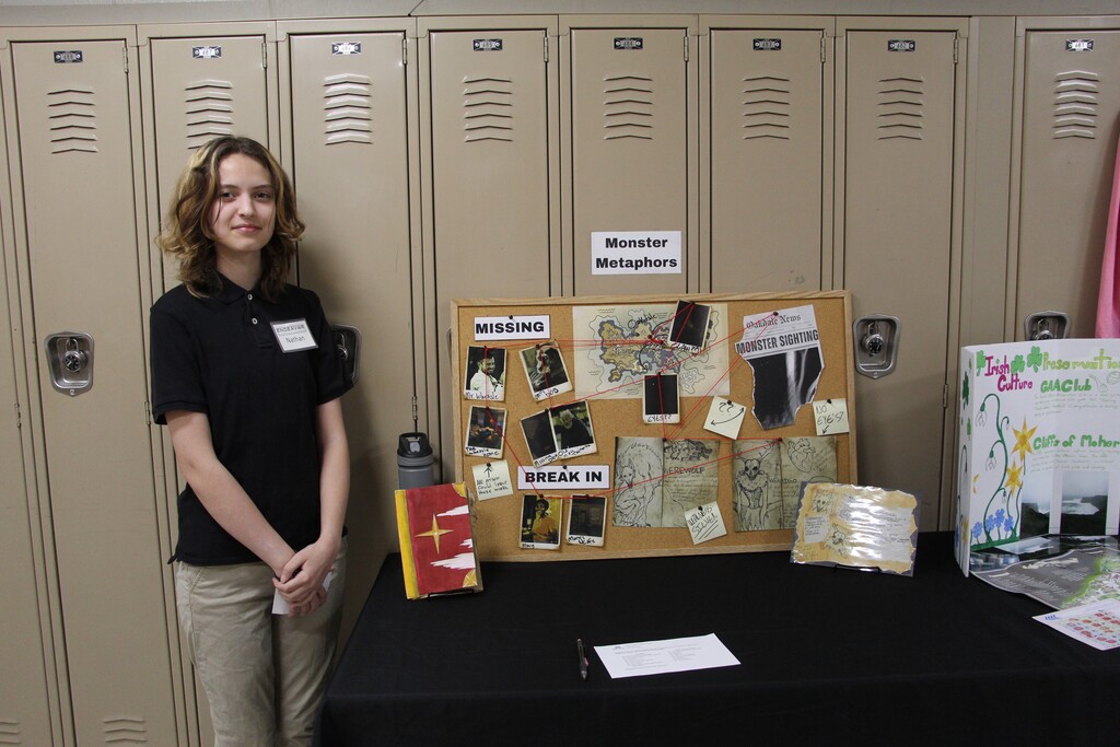 Endeavor Charter School hosts Gallery Night. Pictured is a student presenting their year-end project.