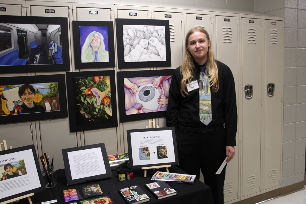 Endeavor Charter School hosts Gallery Night. Pictured is a student presenting their year-end project.