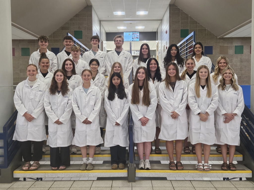 23 Watertown High School students are pictured in their "white coats" after completing the Project Lead the Way course series.