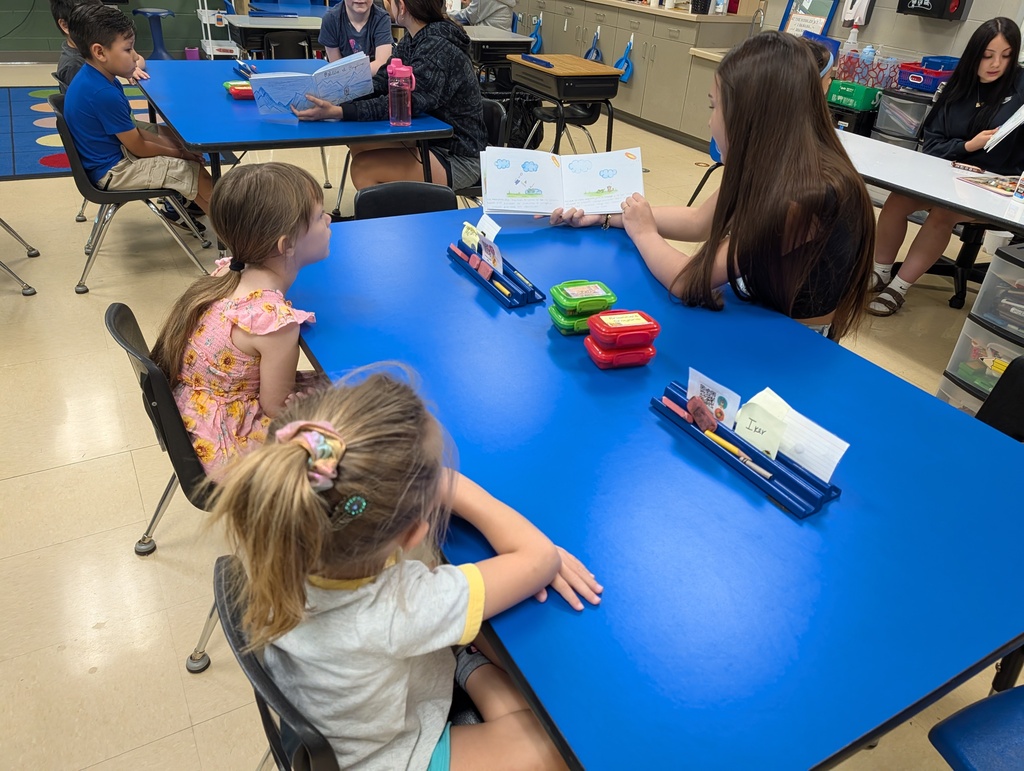 Dual Language Program - High School students read books to kindergartners at Schurz Elementary School