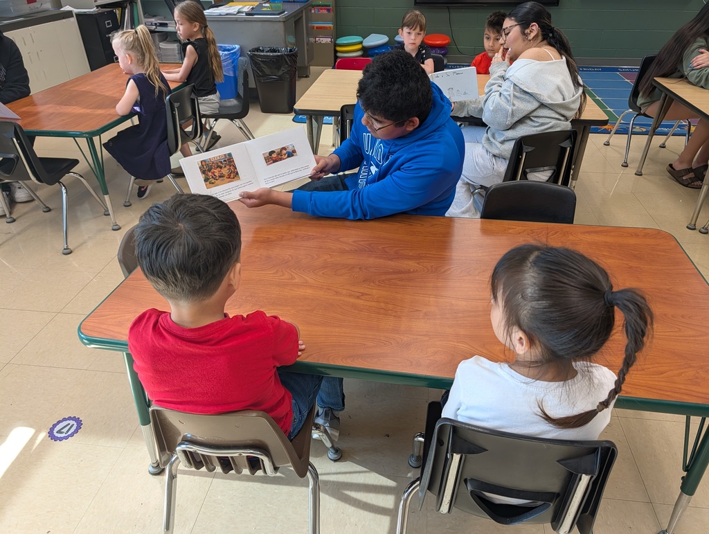 Dual Language Program - High School students read books to kindergartners at Schurz Elementary School