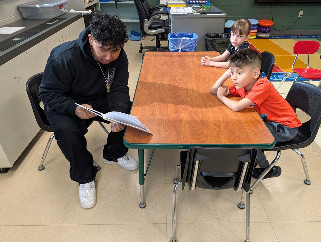Dual Language Program - High School students read books to kindergartners at Schurz Elementary School