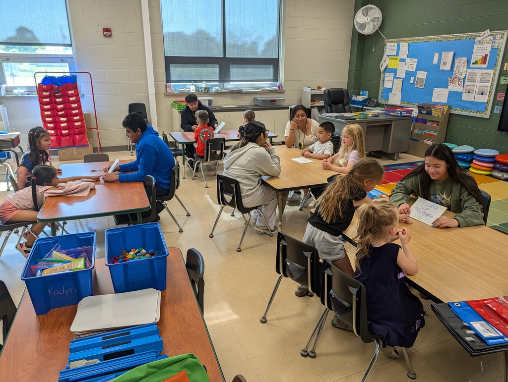 Dual Language Program - High School students read books to kindergartners at Schurz Elementary School