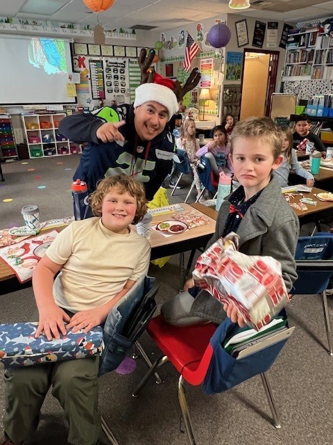 CIS handing out gifts to students.