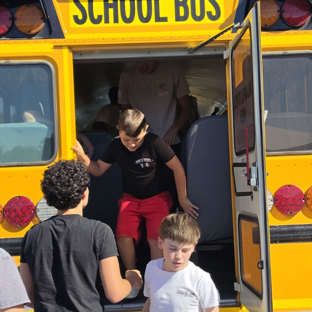 Student getting off a school bus.