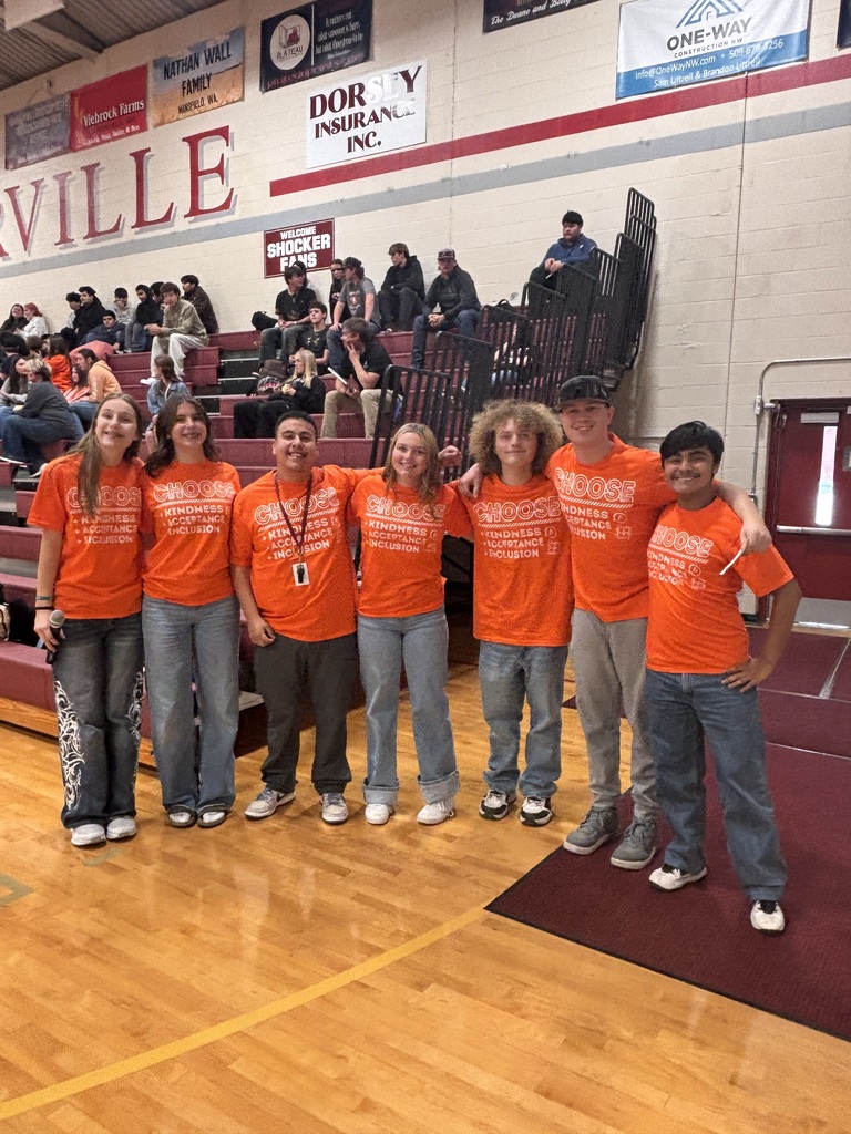 Students in orange T-Shirts.