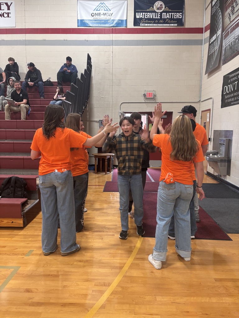 Students giving high five.