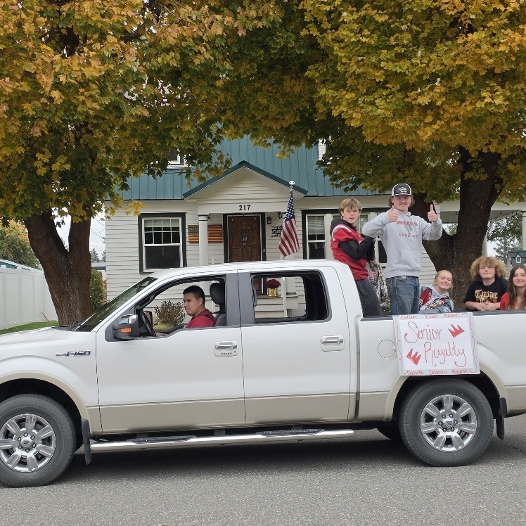 Students riding on a truck