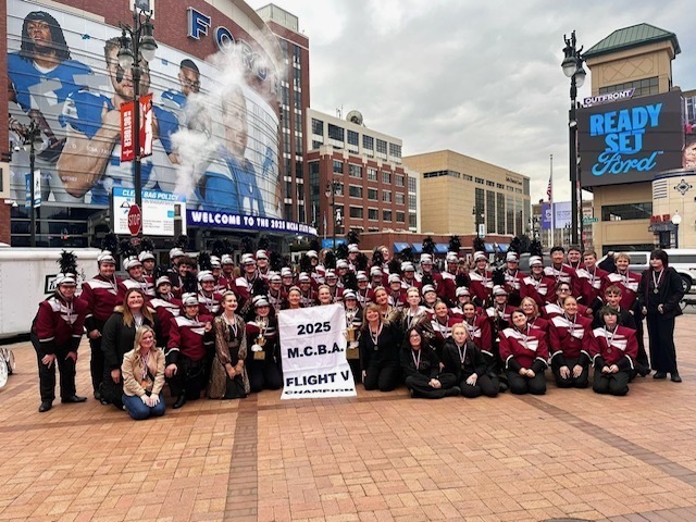 Band members outside of Lions Stadium