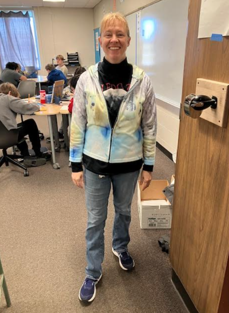 image of teacher standing at the door 