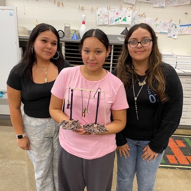 Students holding their kinetic sculpture