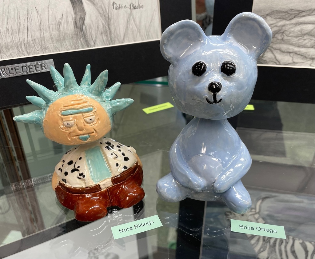 Bear and person bobble head