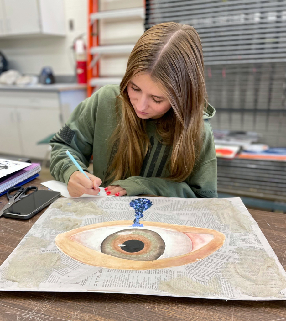 student creating her 6 words colored pencil drawing