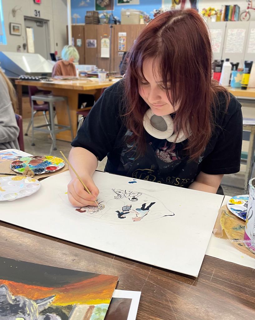 student painting her 6 words piece