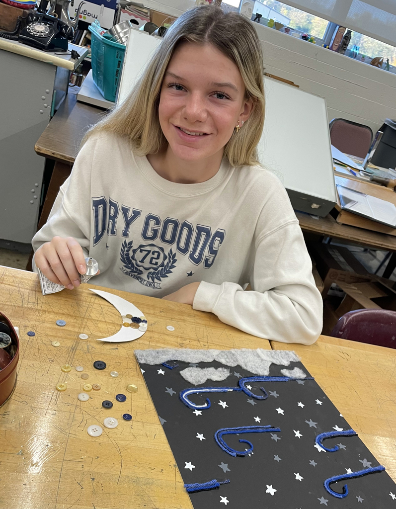 student creating moon & stars six words piece