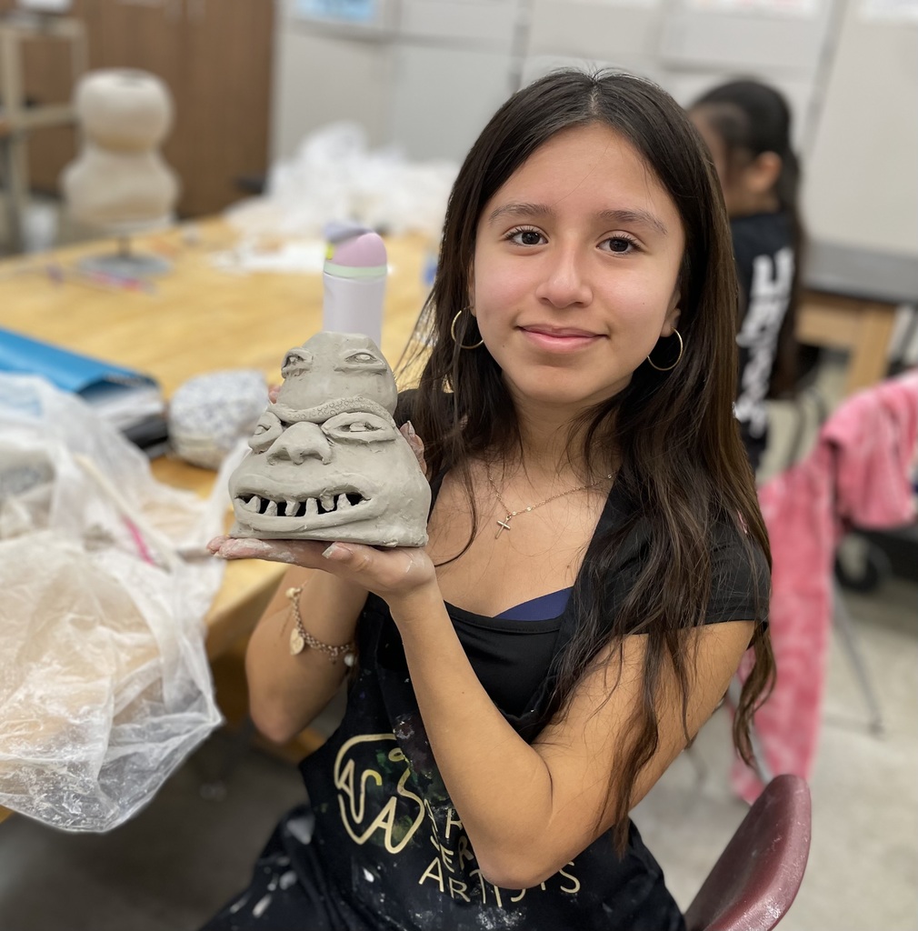 femaile student holding her ugly jug