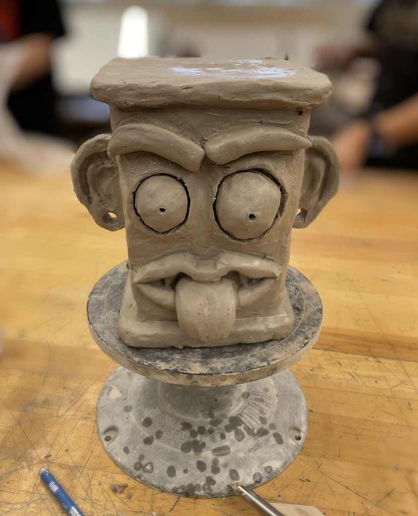 clay project of face with tongue sticking out