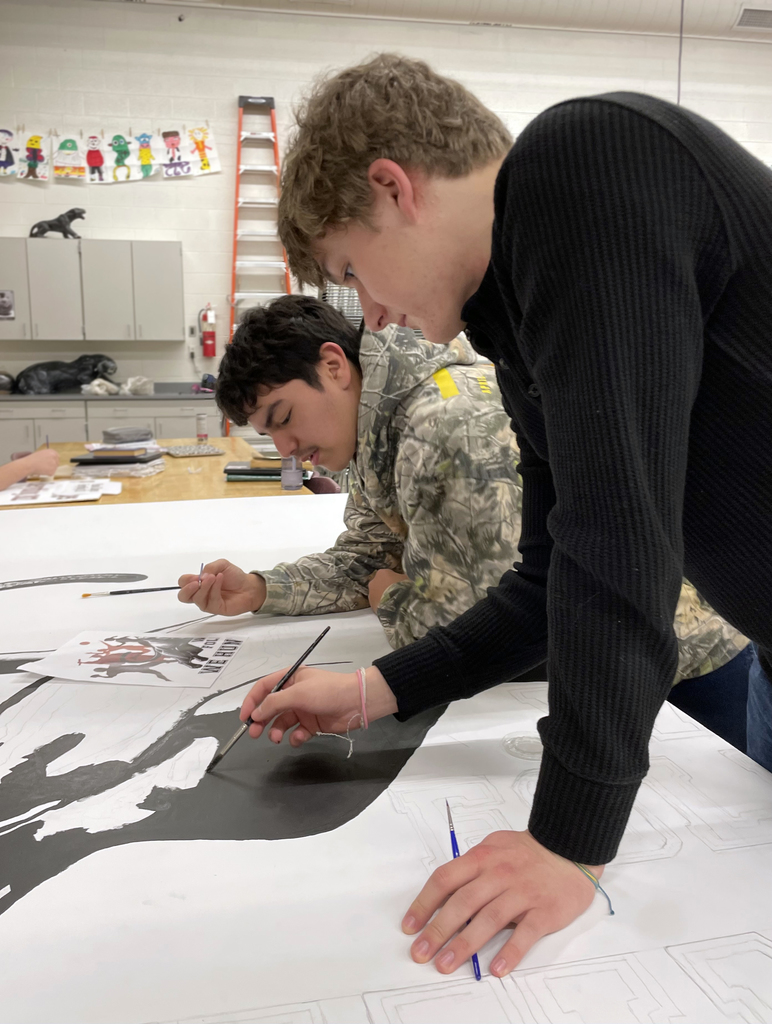 male students painting