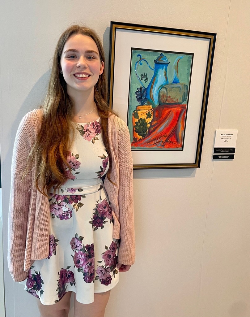 female student next to her painting of vases, "Chaotic Vessels"