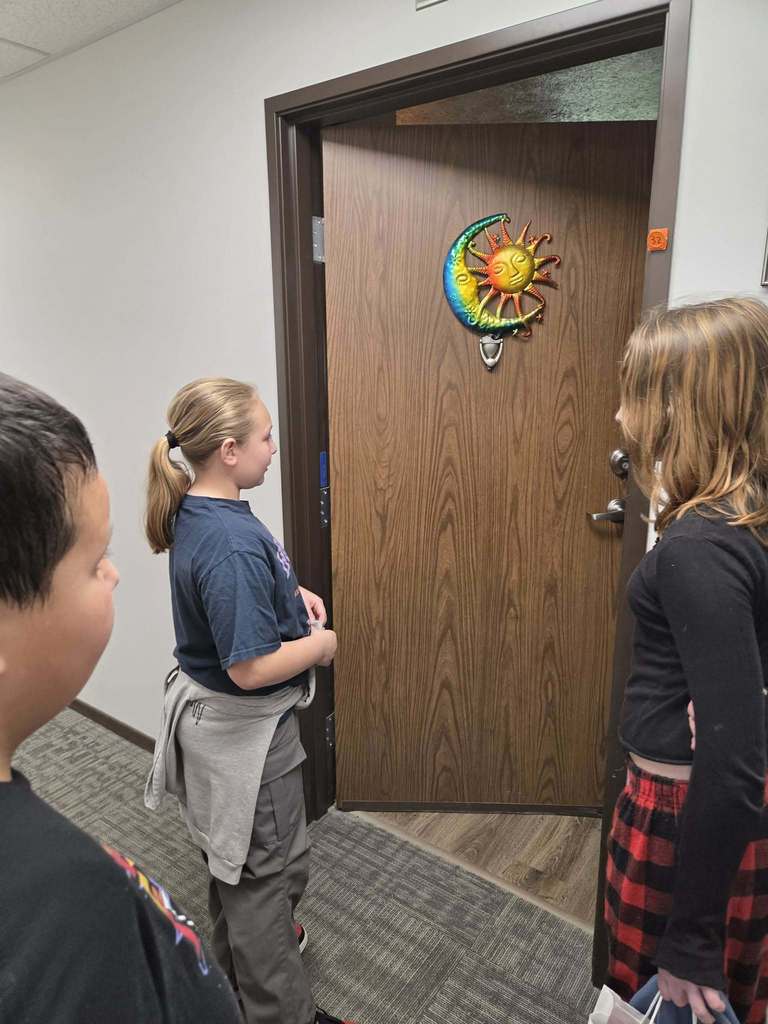 Child standing at doorway