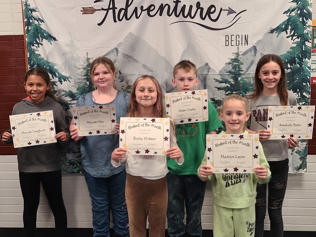 A group of students each holding a certificate