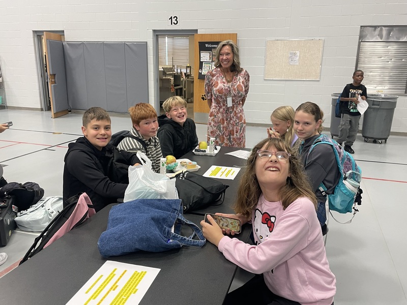 MS students in the lunch room with Mrs. Adams