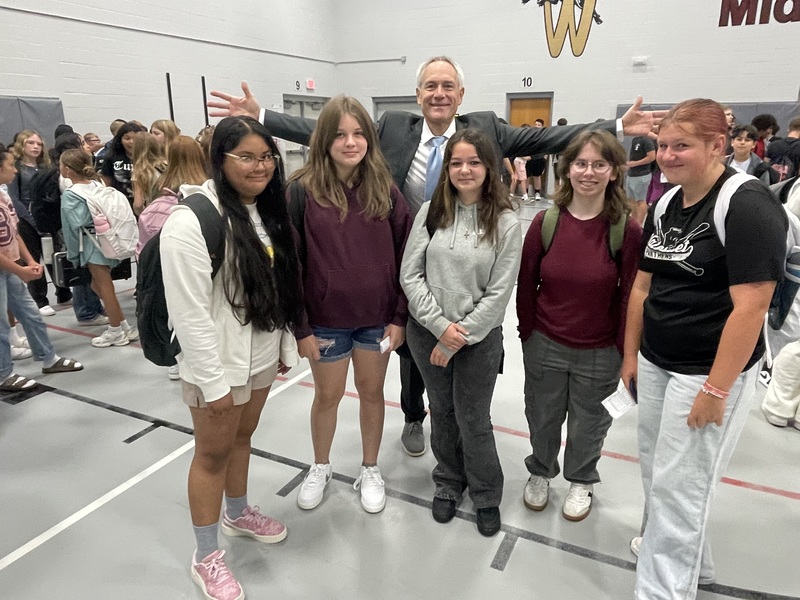 Middle  School Principal Kindt standing behind a group of students