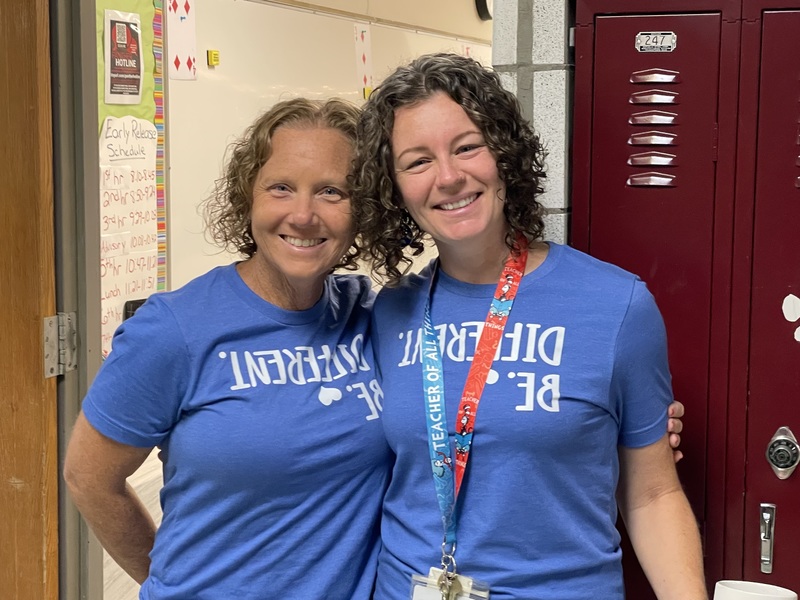 two female teachers with identical blue t-shirts
