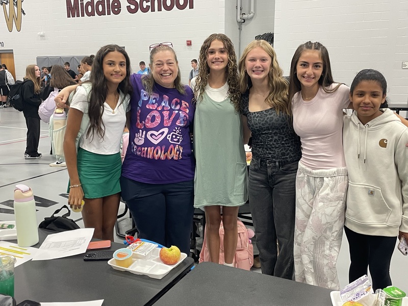 Middle School student with a MS teacher in the gym
