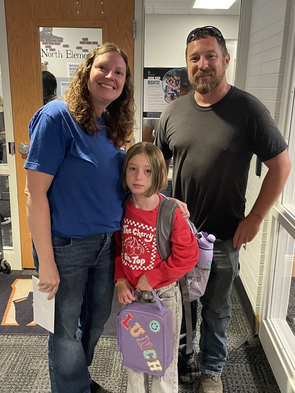 Parents with student on the first day of school