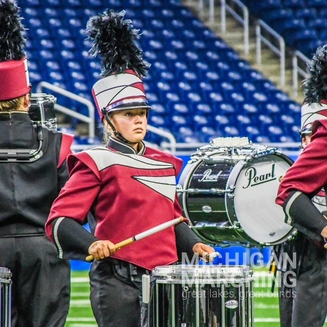 Band member playing instrument