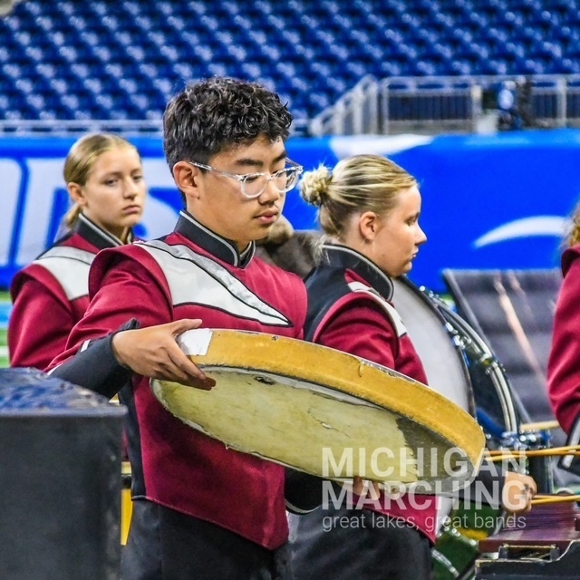 Band member playing instrument
