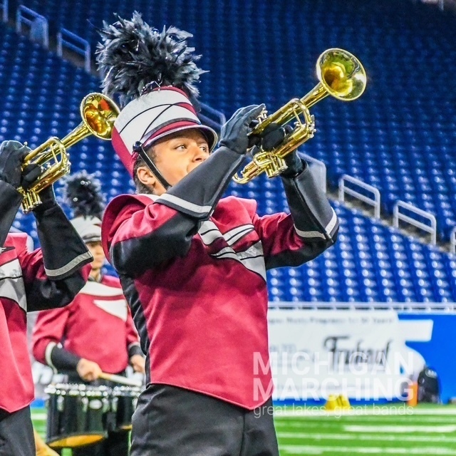 Band member playing instrument