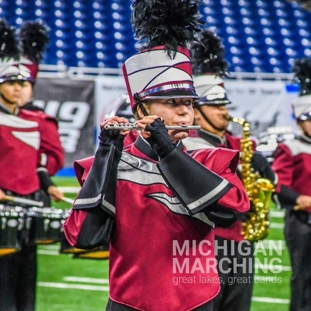 Band member playing instrument