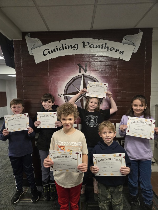 Students holding certificates