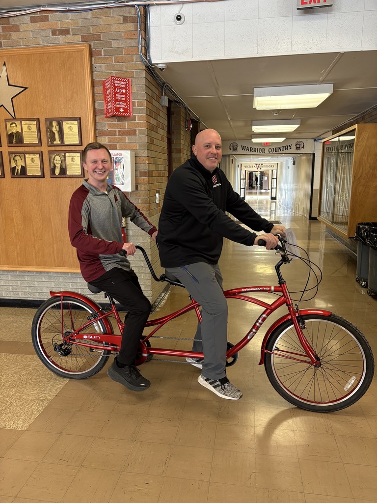 Two principals riding their bike
