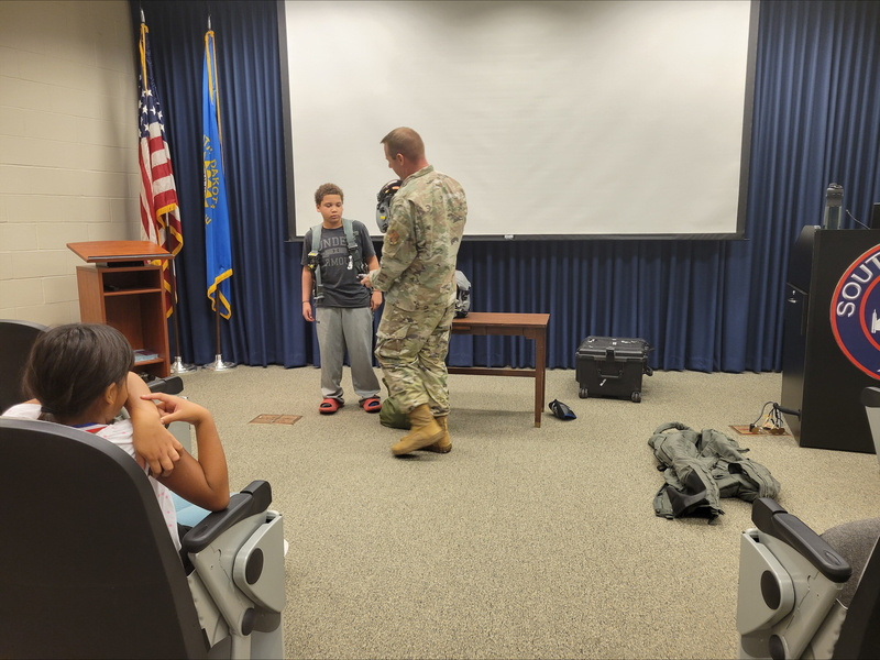 Student with backpack on 